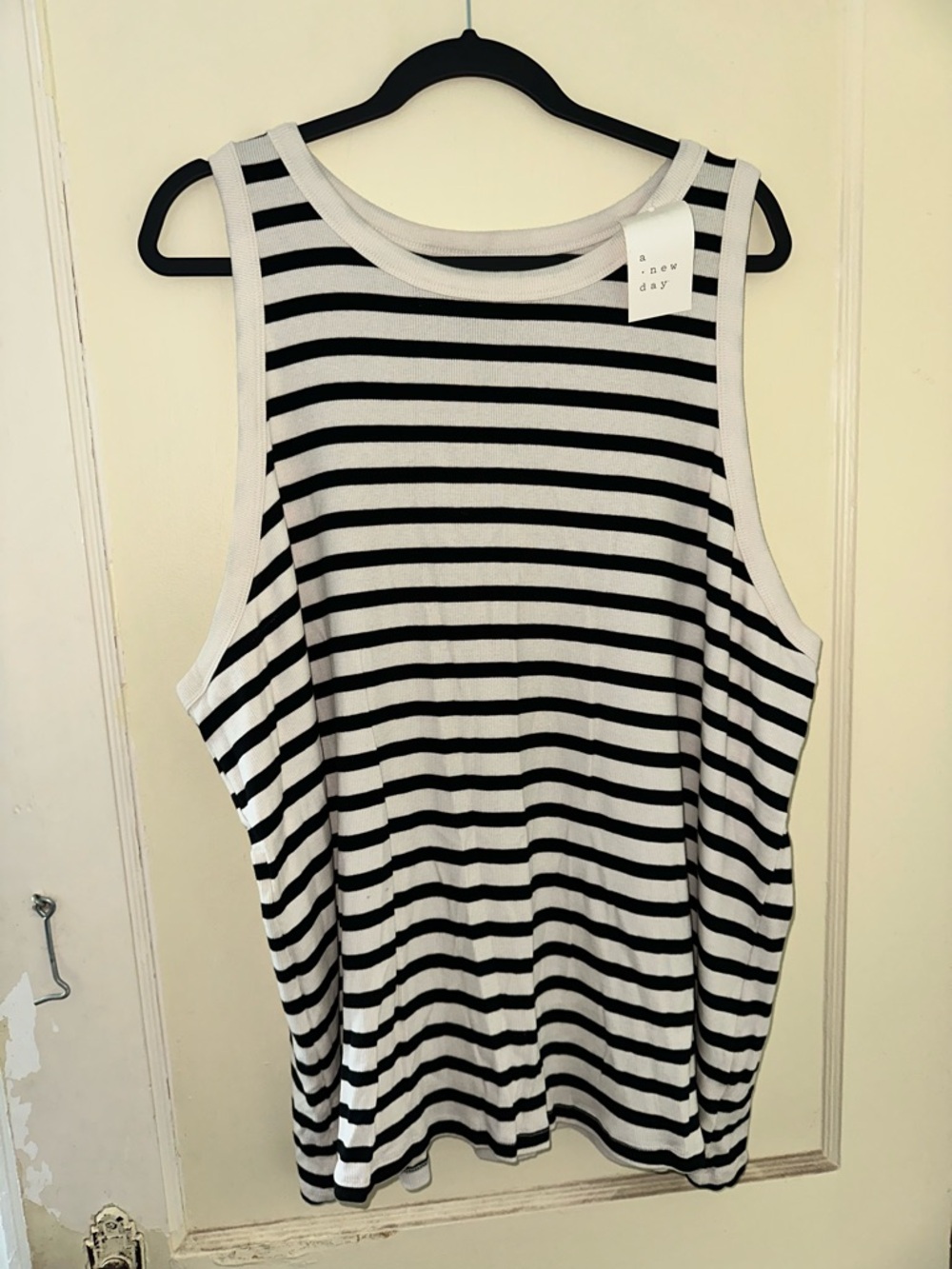a new day cream & black striped sleeveless tank